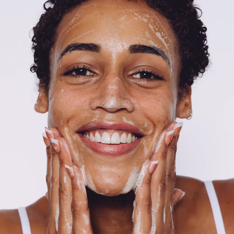 Model washing there face with CellDerma HYDRACLEAN Botanical Cleanser Moisturising Soothing facial wash