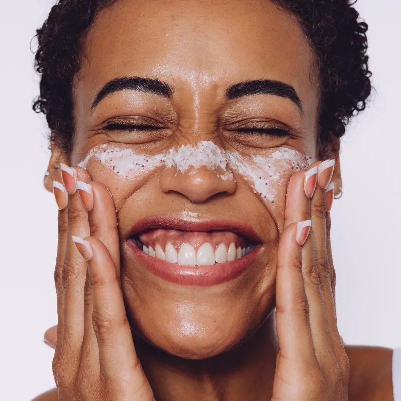 Model using CellDerma PHA RENEWAL SCRUB with Antioxidants Exfoliating Cleanser Brightening Hydrating skincare product